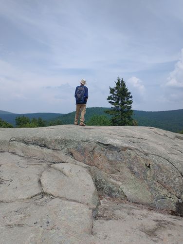 The rocky top of Turtleback Mountain with subdued views of the surrounding area