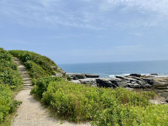 Stone stairway leads up a hillside alongside the Atlantic Ocean