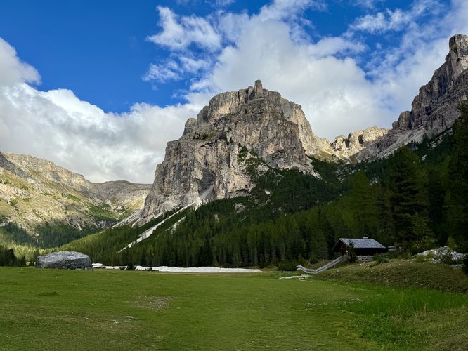 The Vallunga trail leads into a wide open valley below alpine peaks