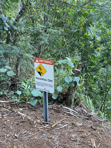 Hazardous cliffs - do not go beyond rock wall
