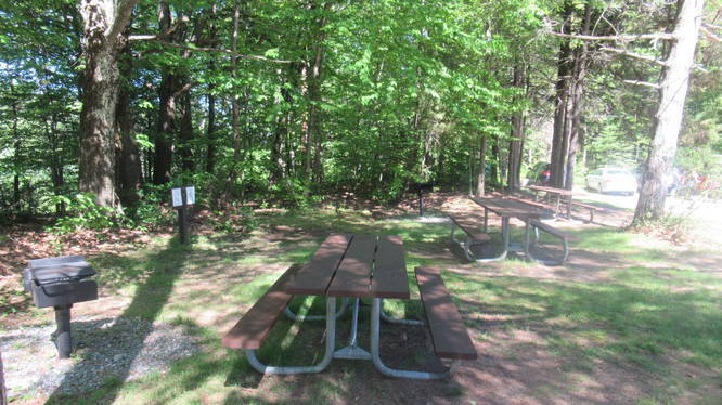 Picnic benches at the base parking area