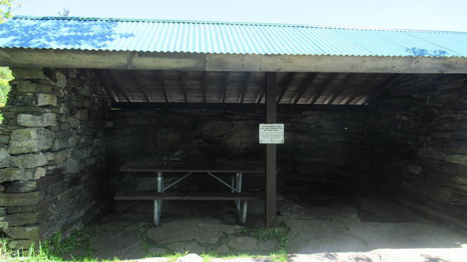 Picnic bench at the summit has shade and weather protection