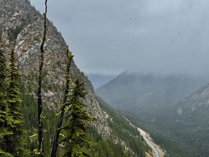 View of the highway below surrounded by alpine slopes