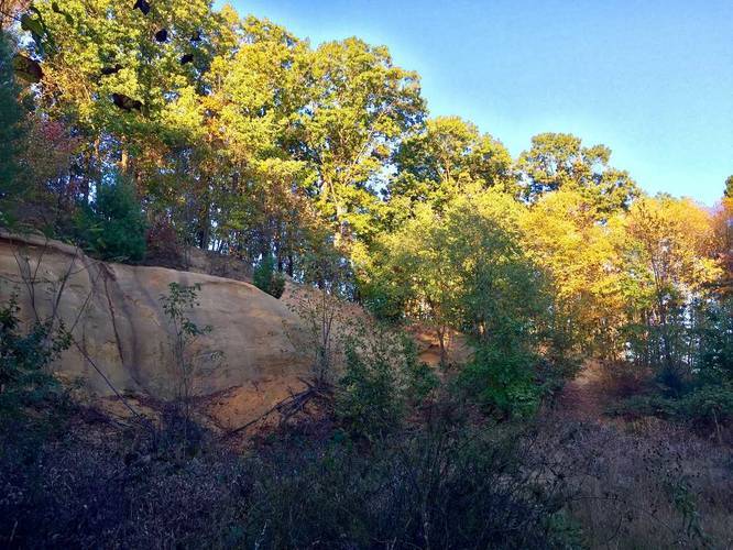 Rock cliffs along the trail about 15 feet tall