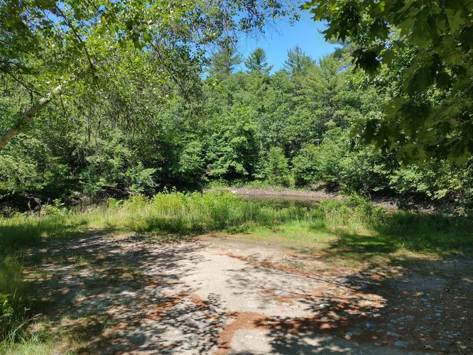 Small parking area enough for 3 cars on the North Side of the trail
